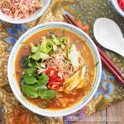  Laksa Penang: ซดความหอมมันของกะทิที่ซ่อนอยู่ในน้ำซุปสีแดงสดสไตล์มาเลย์